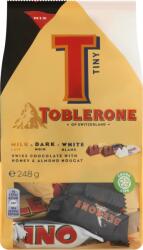 Toblerone Svájci tej- fehér- és étcsokoládé válogatás mézzel és mandula nugáttal 248 g