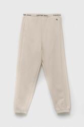 Calvin Klein Jeans pantaloni de trening pentru copii culoarea bej, neted 9BYX-SPB013_01X