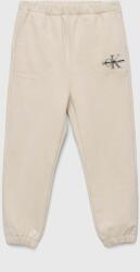 Calvin Klein Jeans pantaloni de trening pentru copii culoarea bej, neted 9BYX-SPG01E_01X