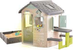 Smoby Ökobarát házikó homokozóval az ablak alatt natúr barna színvilágban Neo Jura Lodge Playhouse Green Smoby tovább bővíthető (SM810230-2I)