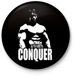 printfashion Arnold Conquer - Kitűző, hűtőmágnes - Fekete (3096005)