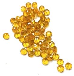 Gyöngy üveg csiszolt fánk 4x3mm borostyán min. 60db