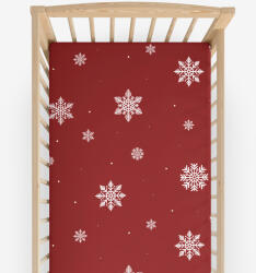 Goldea gyermek körgumis pamut lepedő kiságyba - hópelyhek piros alapon 60 x 120 cm