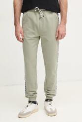 GUESS melegítőnadrág zöld, nyomott mintás - zöld XL - answear - 33 990 Ft