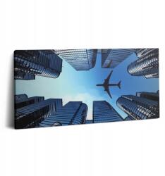 Wallfluent Vászonkép Canvas Előszoba Lakberendezés Repülőgép Épületek felett 100x50 (010030010010000074978)