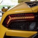  Set 2 folii autoadezive decupate pentru decorarea stopurilor auto, dimensiune 2 x 48 x 30cm, culoare Negru Mat, model HONEYCOMB TRIANGLE FAVLine Selection