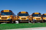 Dimex Vlies Fotótapéta - Row of school buses - 375x250 cm (MS-5-2717)
