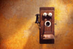 Dimex Vlies Fotótapéta - Antique Telephone on Yellow Wall - 375x250 cm (MS-5-2082)