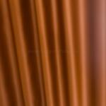 FüggönyFutár Webáruház Darnel - Tégalvörös/okkersárga színű kétoldalas dimout sötétítő függöny, egyedi méretre, készre varrjuk