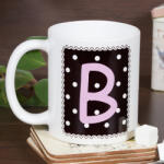 NagyAjándék Pöttyös monogramos fekete bögre