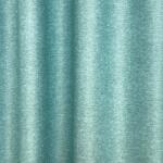 FüggönyFutár Webáruház Austin -Türkiz zöld színű, szórt nyomott mintás dim out sötétítő függöny, egyedi méretre, készre varrjuk