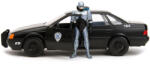 Jada Macheta 1/24 1986 Ford Tarus cu figurina RoboCop , black/silver (JPT)